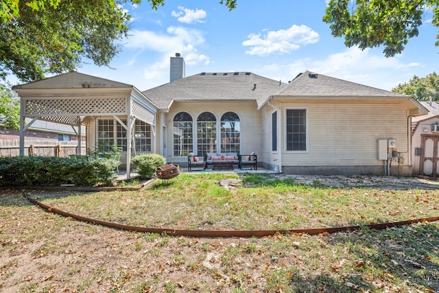 back of property with a lawn, a gazebo, and a patio area