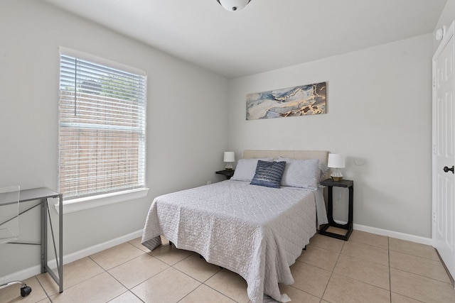 bedroom featuring light tile patterned floors