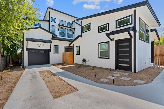 view of front of home featuring a garage and cooling unit