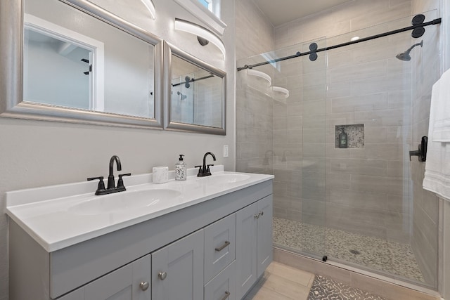 bathroom featuring vanity, tile patterned floors, and walk in shower