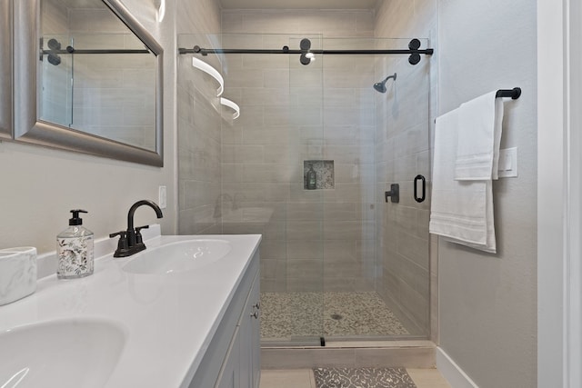 bathroom with vanity, an enclosed shower, and wood-type flooring