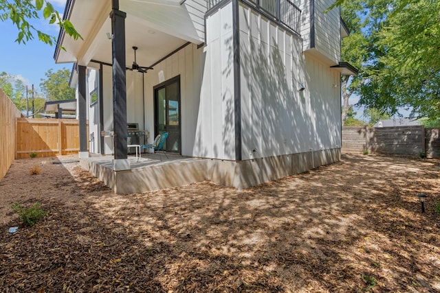 view of home's exterior featuring a patio and ceiling fan