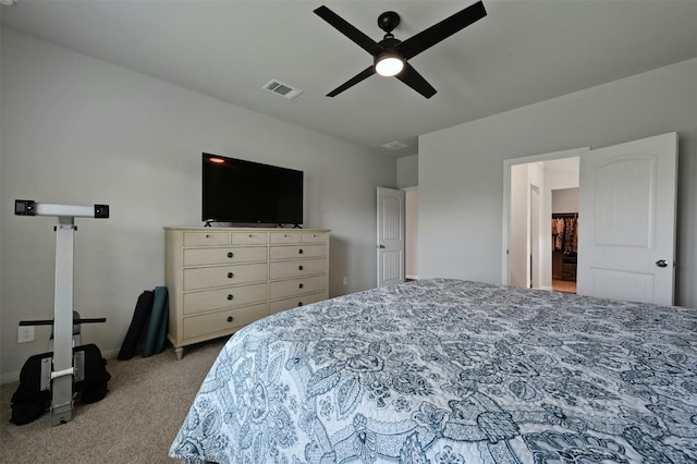 bedroom featuring ceiling fan and light colored carpet