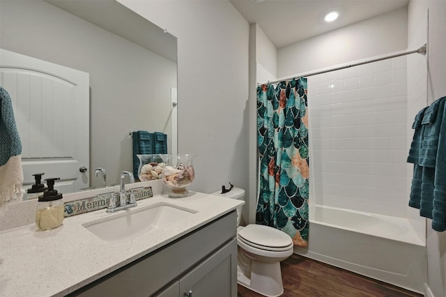 full bathroom with shower / bath combination with curtain, wood-type flooring, vanity, and toilet