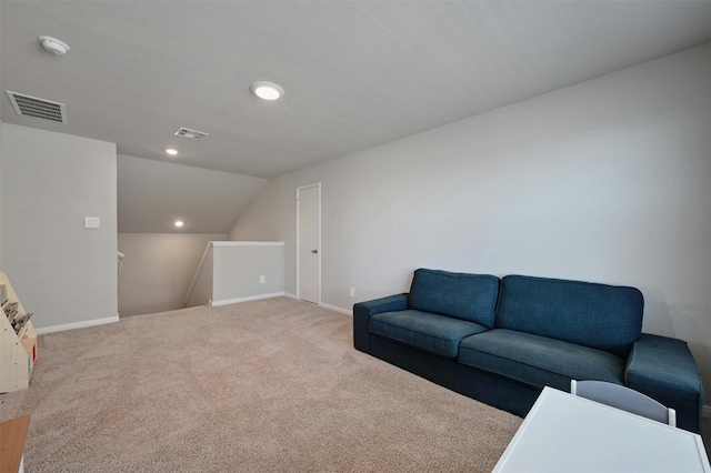 carpeted living room featuring lofted ceiling