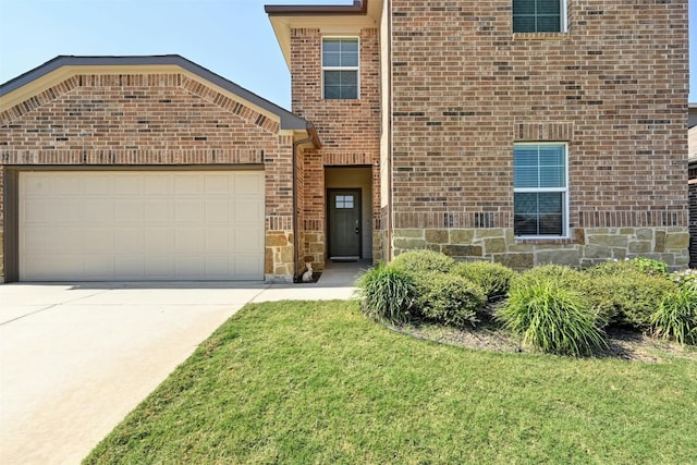 front facade with a front lawn and a garage