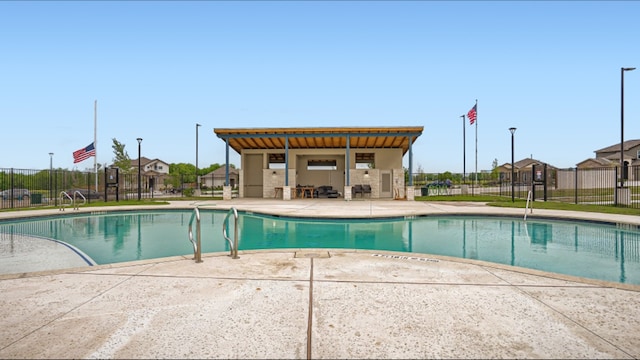 view of swimming pool with a patio