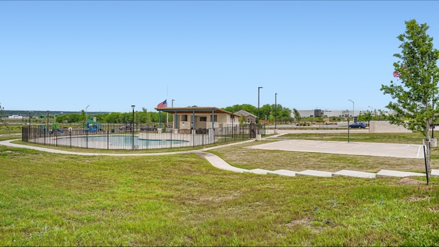 view of yard featuring a community pool