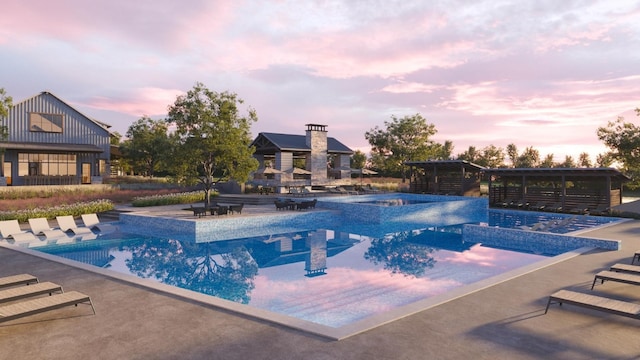 pool at dusk with a fireplace, a hot tub, and a patio area