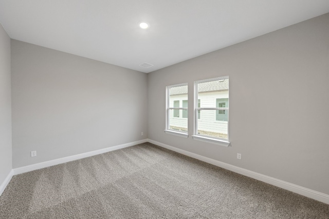 empty room featuring carpet flooring