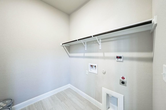 laundry room featuring hookup for an electric dryer, hookup for a gas dryer, hookup for a washing machine, and hardwood / wood-style floors