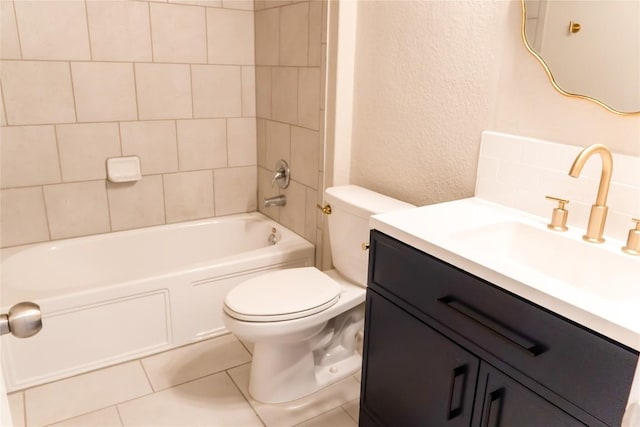 full bathroom featuring tile patterned floors, vanity, toilet, and tiled shower / bath