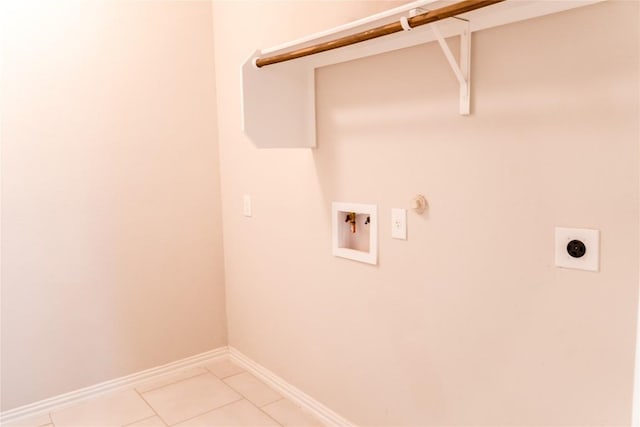 washroom featuring electric dryer hookup, gas dryer hookup, light tile patterned floors, and hookup for a washing machine