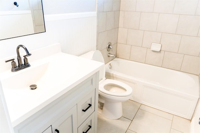 full bathroom with tile patterned floors, vanity, toilet, and tiled shower / bath