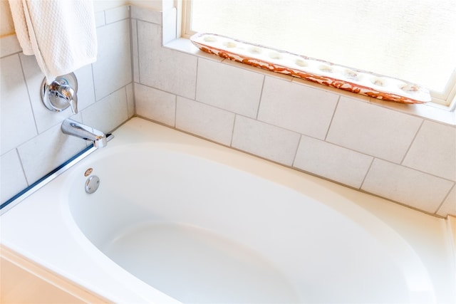 bathroom featuring a tub to relax in