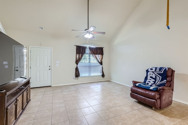 sitting room featuring high vaulted ceiling, ceiling fan, and light tile patterned floors