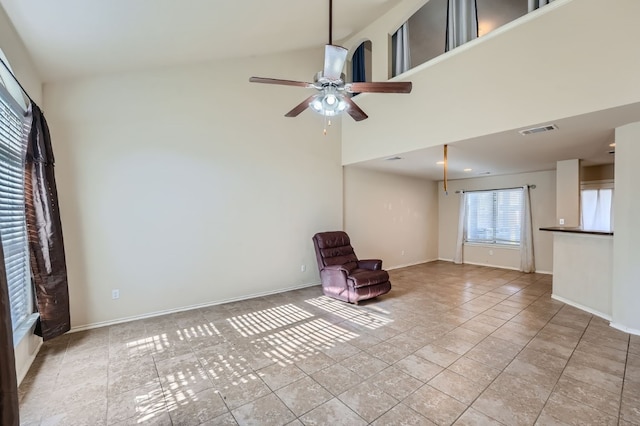 unfurnished room featuring high vaulted ceiling, ceiling fan, and light tile patterned flooring