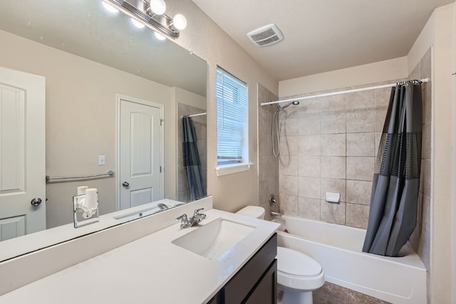 full bathroom featuring shower / tub combo, tile patterned flooring, vanity, and toilet