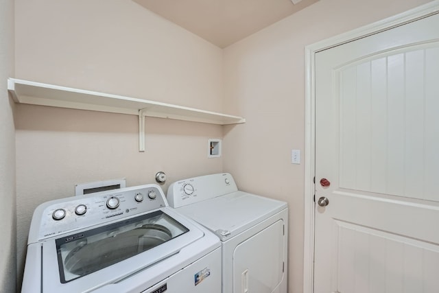 laundry area featuring washing machine and clothes dryer