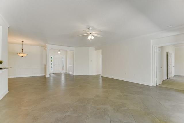 unfurnished living room with light tile patterned floors and ceiling fan