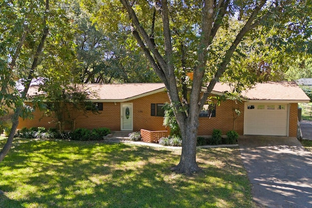 single story home featuring a front yard and a garage