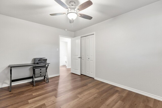 office featuring ceiling fan and dark wood-type flooring