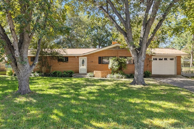 ranch-style home with a garage and a front lawn