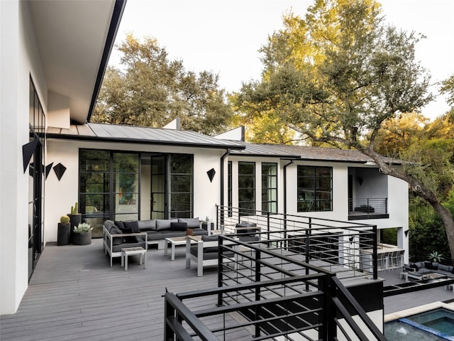 wooden deck with an outdoor hangout area