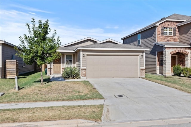 view of front of property with a front lawn and a garage