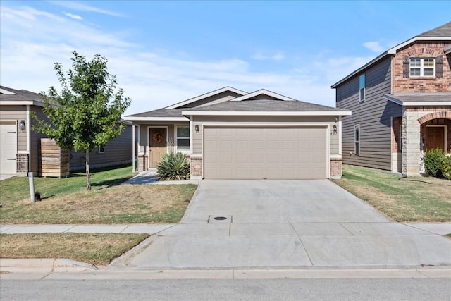 view of front of property featuring a garage and a front yard