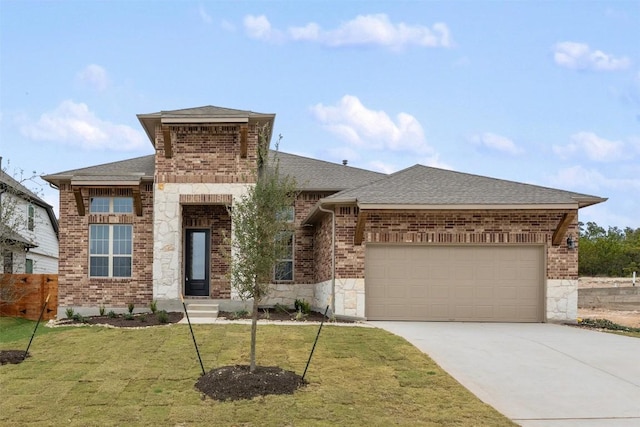 view of front of house with a garage and a front lawn