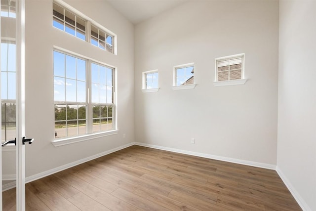 spare room featuring hardwood / wood-style floors