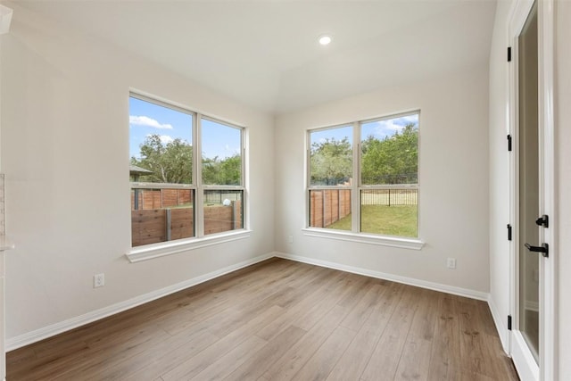 spare room with light hardwood / wood-style floors