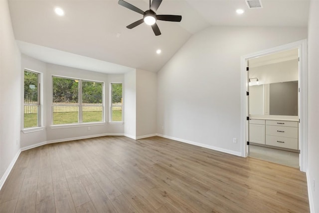 interior space with ceiling fan, light hardwood / wood-style floors, and lofted ceiling