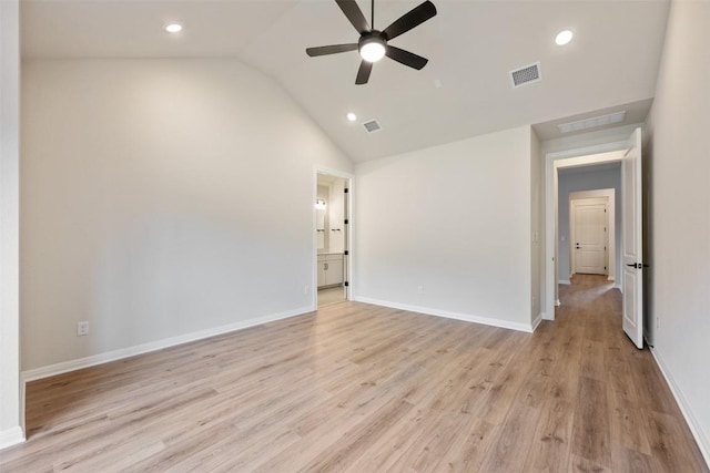 empty room with ceiling fan, light hardwood / wood-style floors, and lofted ceiling