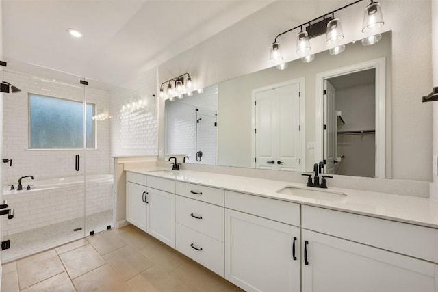 bathroom with tile patterned floors, vanity, and plus walk in shower