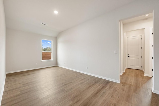 empty room with light hardwood / wood-style floors