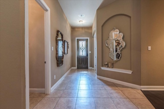 entryway featuring light tile patterned floors