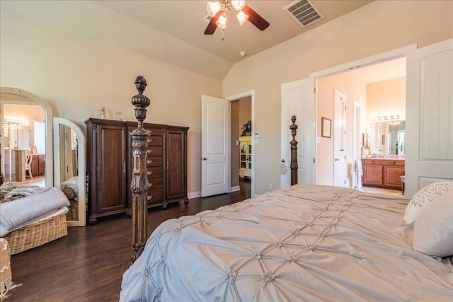 bedroom with ceiling fan, ensuite bathroom, lofted ceiling, and dark wood-type flooring