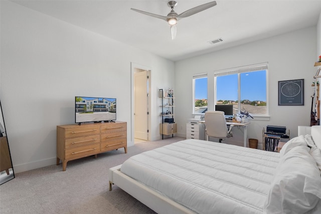 bedroom with light carpet and ceiling fan