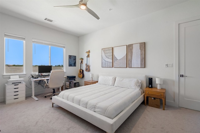 bedroom with light carpet and ceiling fan