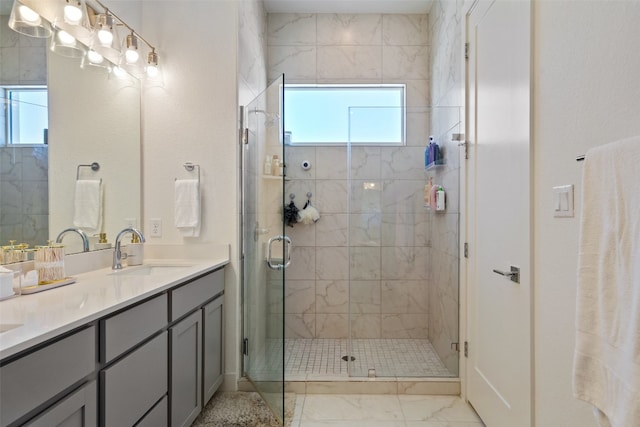 bathroom featuring walk in shower and vanity