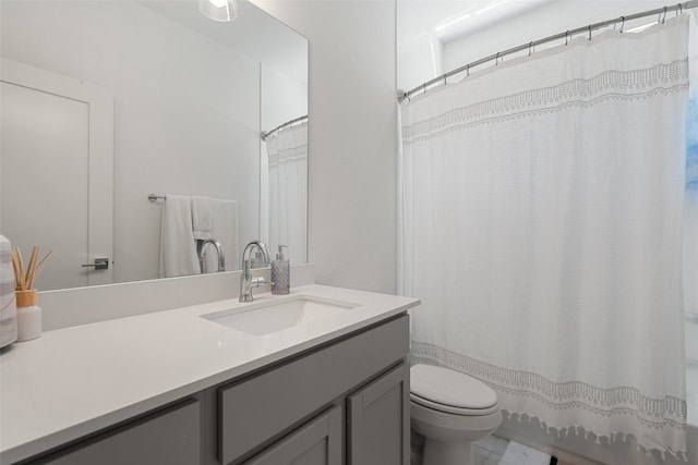 bathroom with vanity, toilet, and a shower with shower curtain