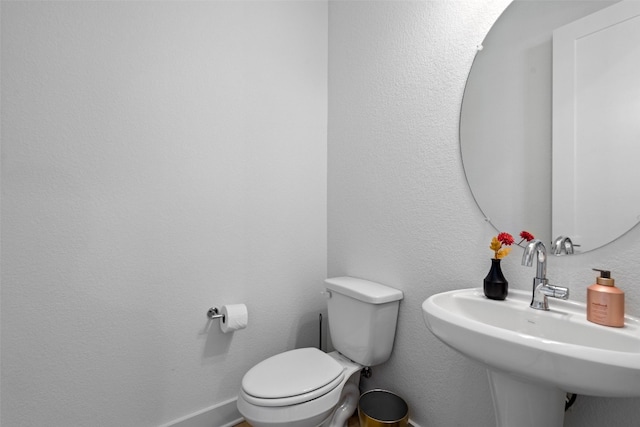 bathroom with sink and toilet