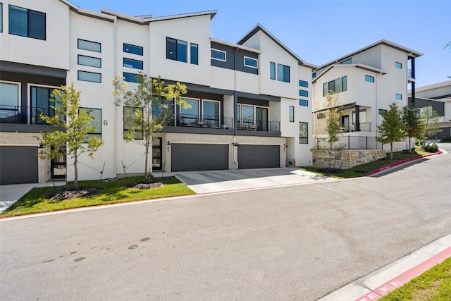 view of front of house with a balcony and a garage