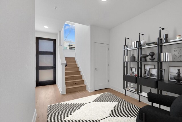 2050 Lohmans Spur Unit 603, Austin, TX 78734 - entrance foyer featuring light wood-style floors, baseboards, stairs, and recessed lighting