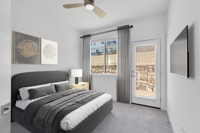 2050 Lohmans Spur Unit 603, Austin, TX 78734 - bedroom with access to exterior, carpet flooring, ceiling fan, and baseboards