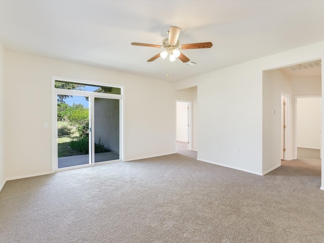 carpeted empty room featuring ceiling fan