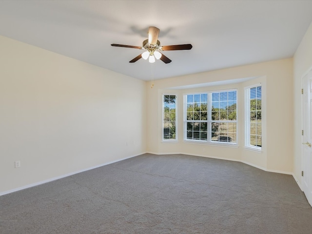 unfurnished room with carpet floors and ceiling fan