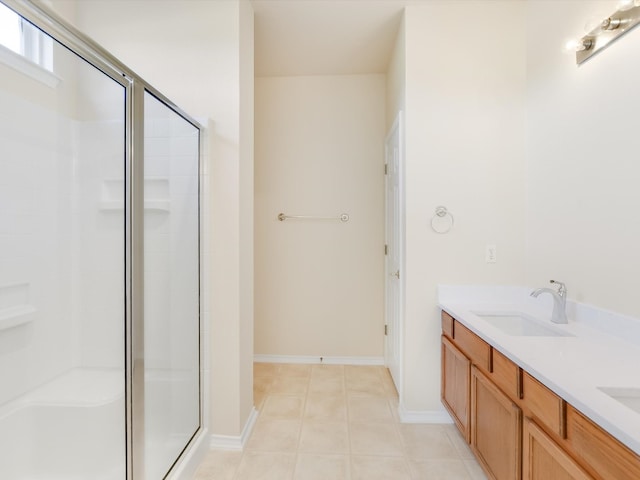 bathroom with vanity, tile patterned floors, and a shower with shower door